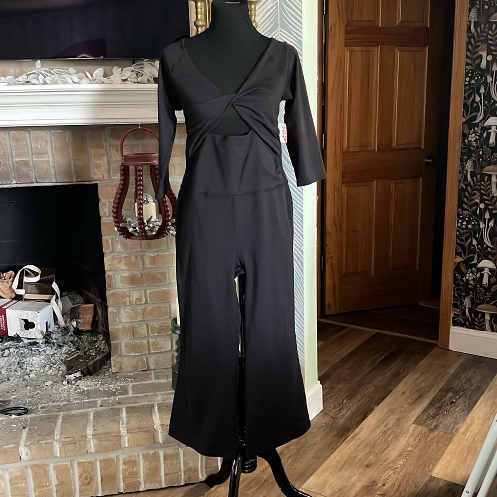 NEW WITH TAGS SOLD OUT FREE PEOPLE ENCHANTE ONE PIECE in black
